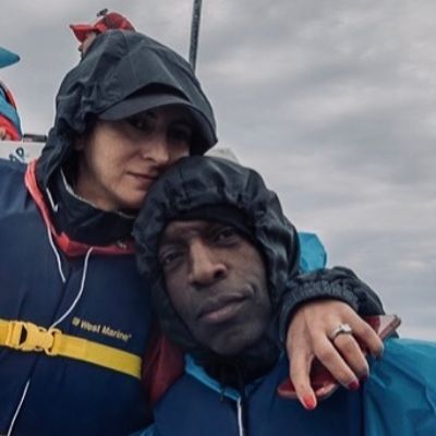 Both Armine Shamiryan and Michael Johnson is wearing a life jacket in the picture as they are in the boat.